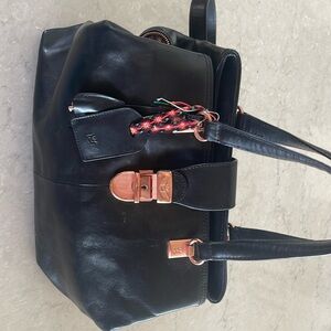 Consuela bag - black with rose gold zipper and buckles.